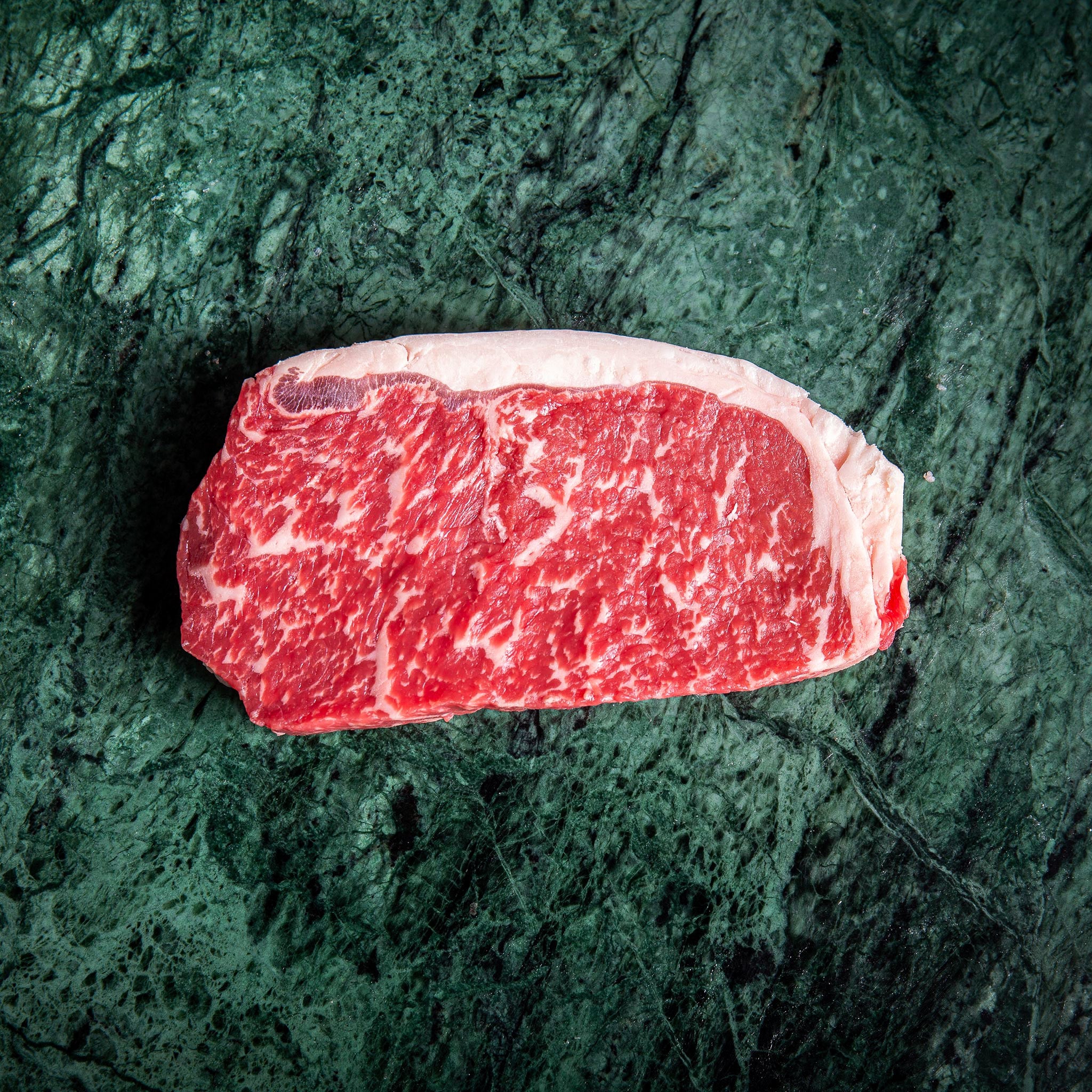 http://www.primegourmet.ae/cdn/shop/products/australian-black-angus-beef-striploin-steak-317947.jpg?v=1695182033